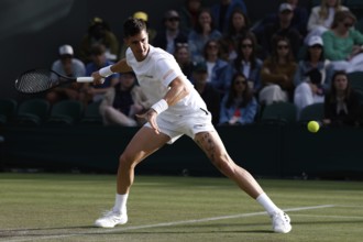 Australian tennis player Thanasi Kokkinakis in action at the 2024 Wimbledon Championships, London,