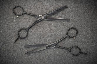Barber Professional Tools. Haircut Fashion. Pair Of Professional Haircutting Scissors On Black