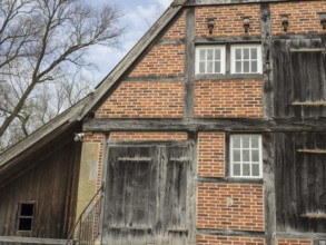 Rustic half-timbered house with striking wooden structure and red bricks, heek, münsterland,