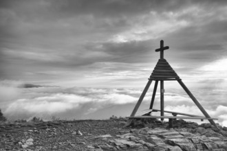 Wooden monument in Gerlitzen Apls, Austria. Inverse weather