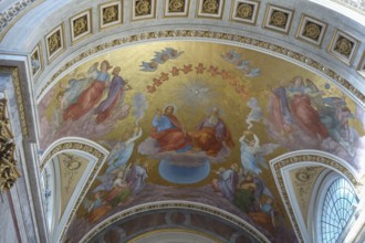 Ceiling fresco in a church with angels and a heavenly scene on a golden background, szentendere,