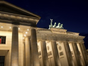 Side view of the Brandenburg Tor at night, architectural details illuminated, Berlin, Germany,