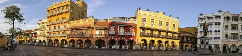 Panorama of an ensemble of colorful historic buildings on a sunny day in Cartagena, Colombia,