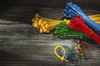 Composition of plastic cables on vintage wooden board