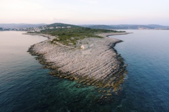 Cape Punta Planca with an old stone church. Aerial view.