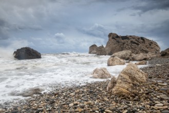 Seascape with windy waves during stormy weather at the rocky coastal area of the Rock of Aphrodite