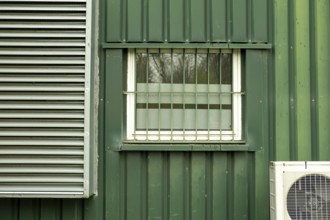 Old office building with windows and air conditioning