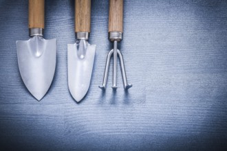 Two garden spades and fork