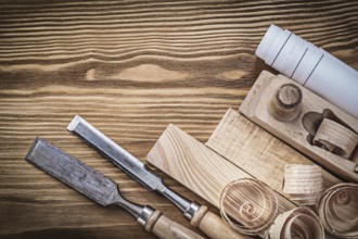 Engineering drawing planer chisels wooden bricks shavings on wood board