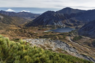 Beautiful autumn mountain landscape: picturesque view of mountains, lake and volcanoes. Far East,