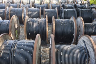 14.06.2017, Berlin, Germany, Europe, Black underground cables for the power supply are wound onto