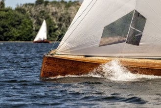 Classic sailing yacht sailing on a lake during a regatta