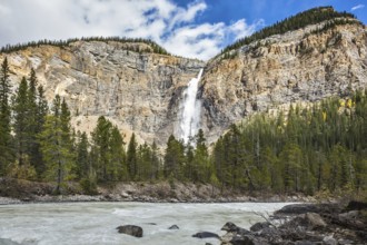 Sunny autumn day in Yoho National Park in the Rocky Mountains of Canada. Colossal Takakkaw