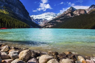 Glacial Lake Louise - the lake with azure water is surrounded by forests and mountains. Rocky