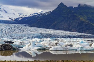 Cold summer in the Arctic. Jokulsarlon glacial lagoon. The imposing scenic lagoon in the north of
