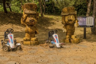 Geosan, South Korea, August 26, 2020: Carved wood statues of Korean police officers in mountain