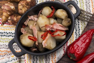 Jerusalem artichoke au gratin with ham and chili. Fricassee, fruits