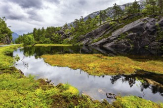 Scenic landscape in Western Norway. The picturesque road in Norway. Summer cold and rainy day.