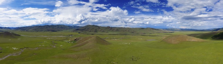 Aerial panorama view of yurts in steppe and mountains landscape in Orkhon valley, Mongolia, Asia