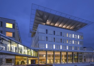 New construction of the University Hospital for Surgery with helicopter landing pad, dusk,