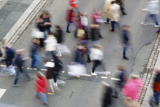 Passers-by crossing a street, long exposure, Germany, Europe