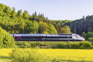 TGV travelling over the Swabian Alb. Idyllic landscape near Lonsee in spring at sunrise. Lonsee,
