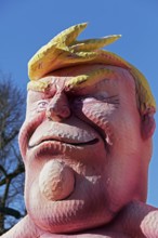 US President Donald Trump, head with yellow quiff, papier-mâché figure, Jacques Tilly theme float,