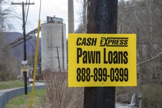Lynch, Kentucky - A pawn shop advertises near coal mining equipment that remains in a former U.S.