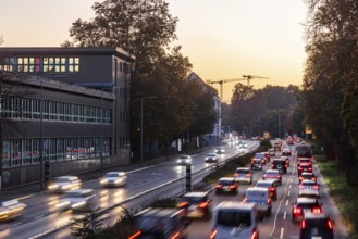 City centre street with heavy traffic in the evening. Dynamic light trails with long exposure time.