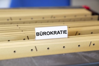 Sign with the inscription BÜROKRATIE on a suspension file folder (symbolic image)