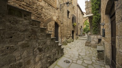 Ancient tufa buildings in the hilltop village of Civita di Bagnoregio, Lazio, Italy, Europe