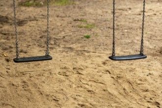 2 swings on a children's playground