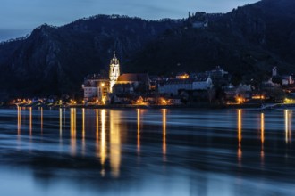 Morning atmosphere at the river, view over the Danube to Dürnstein, blue hour in front of sunrise,