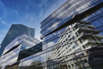 Modern glass building with impressive reflection of the blue sky in the city, Prime Tower, Zurich,