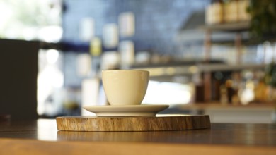 A cup of coffee with a blurred background in a cozy, warm-toned cafe, ISTANBUL, TURKEY