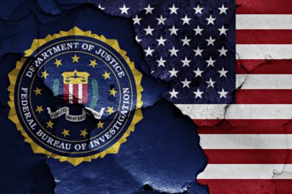 Flag of FBI and USA painted on cracked wall