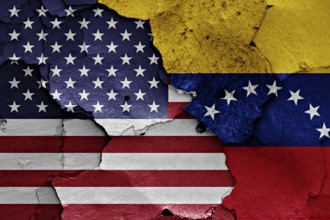 Flags of USA and Venezuela painted on cracked wall