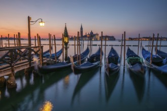 Dawn, Venetian gondolas with the church of San Giorgio Maggiore in the background, Venice, UNESCO