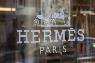 Close-up, logo of the French luxury fashion brand Hermes on a boutique in the shopping street Neuer