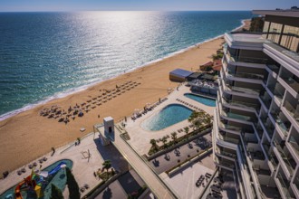 View of a hotel complex with pool on the beach, the Black Sea stretches into the distance, Golden