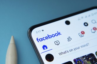 Homepage of Facebook is seen on a smartphone