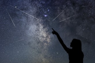 Silhouette of young girl watching Meteor Shower