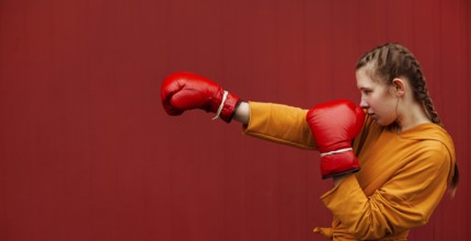 Teenagers posing with boxing gloves