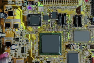 Mainboard computer hardware electronics macro detail with color manipulation