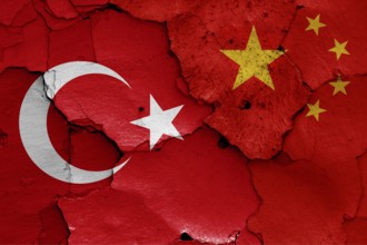 Flags of Turkey and China painted on cracked wall