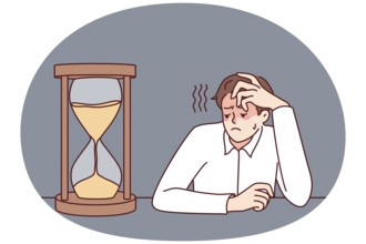 Exhausted businessman looking at hourglass feel bored and overwhelmed. Tired male employee look at