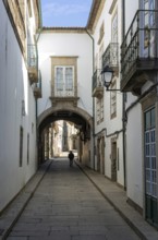 Narrow medieval street Rua de Santa Maria, city centre of Guimaraes, northern Portugal