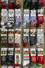 Souvenir gift shop display rack of novelty socks, Guimaraes, northern Portugal
