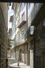 Street of historic buildings with balconies, city centre Guimaraes, northern Portugal