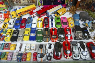 Toy model cars on display in toy shop window, city of Guimaraes, northern Portugal